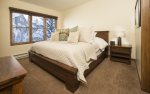 Master suite with king bed, flat screen television, and en-suite bathroom